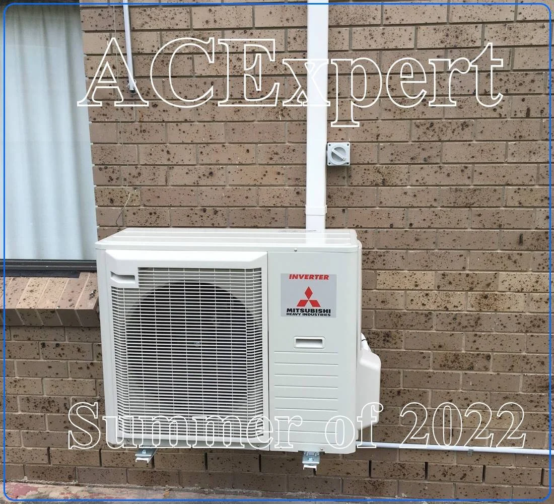Technician installing a split system for veterinary clinics in a Melbourne vet exam room