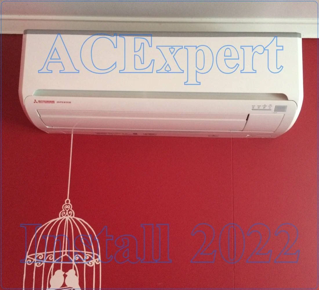 AC expert mounting a split system unit to control showroom lighting heat at a car dealership