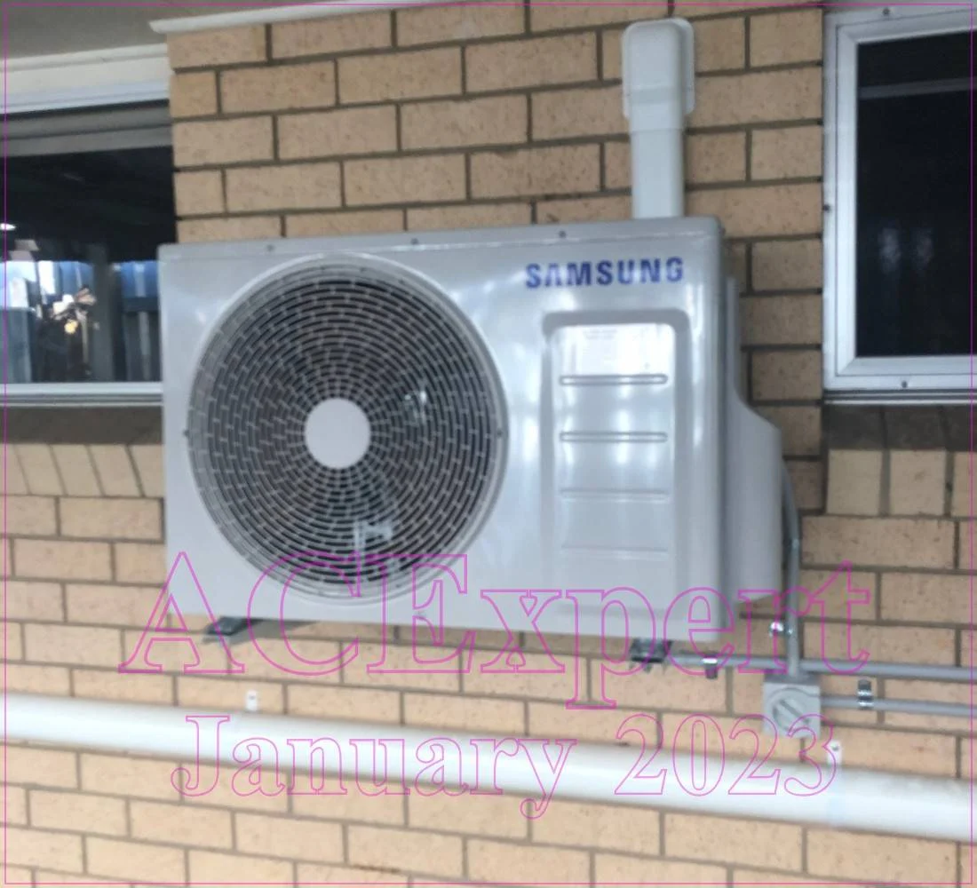 Technician installing a compliant split system air conditioner in a Melbourne childcare centre, ensuring safety and