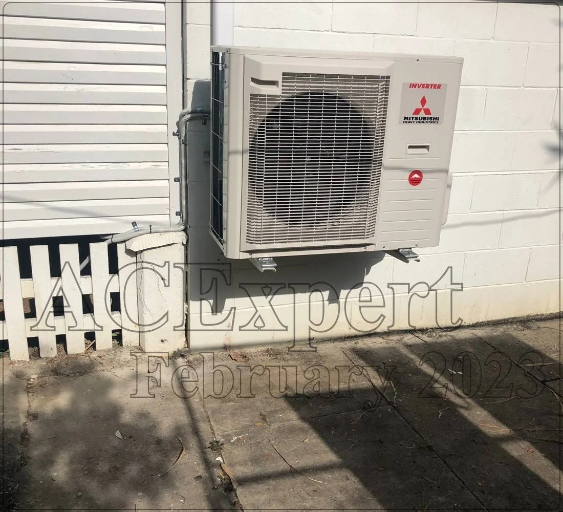 Technician performing split system maintenance on a rooftop unit in Melbourne, ensuring efficient cooling performance