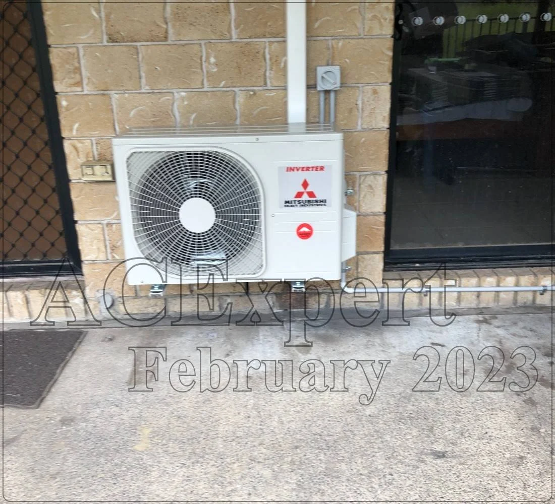 Technician performing split system maintenance on a rooftop air conditioner unit in Melbourne