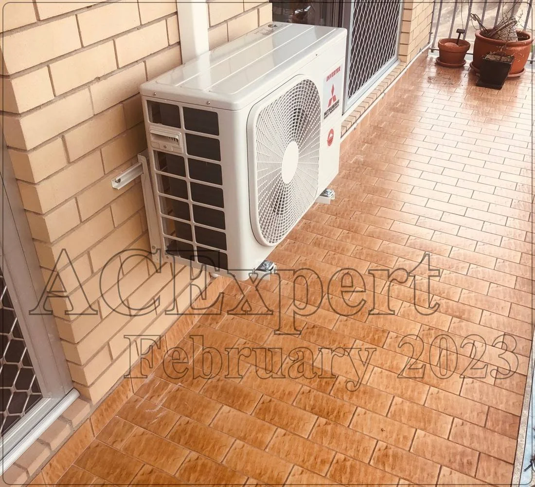 Technician installing a split system with details on small business rebates available at melbournesplitsystems.com
