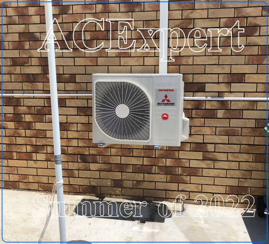 Technician installing a split system air conditioner with details on small business rebates in Melbourne
