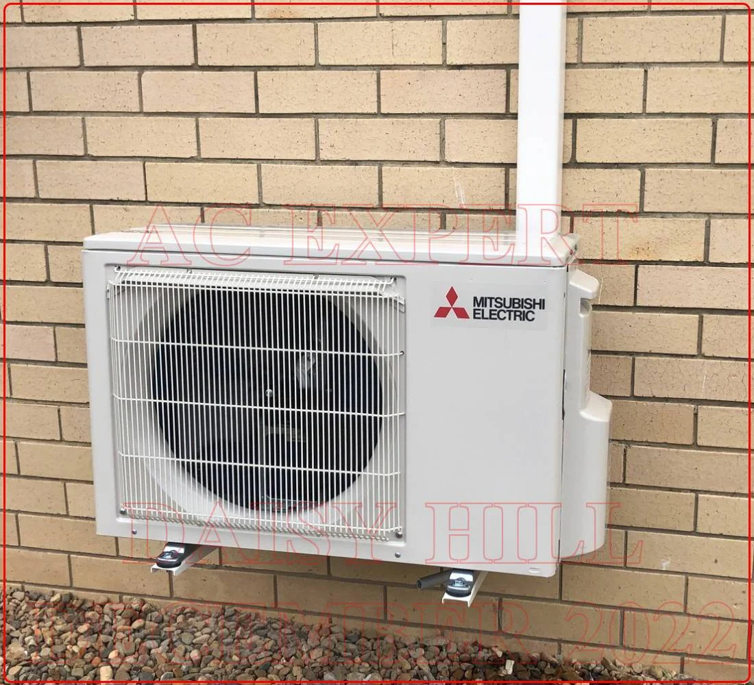 Technician completing a split system installation in a residential setting during a standard fit-out