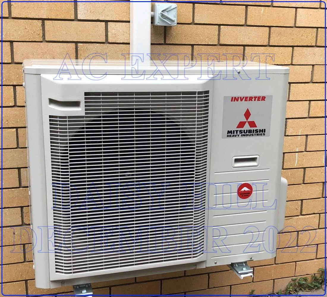 Technician completing a split system installation in a Melbourne home, with wiring and ductwork visible. Call 0420718827 for