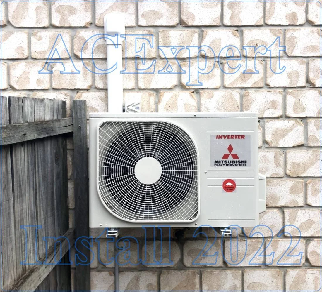 Air conditioning unit mounted on brick wall, designed to minimize cafe noise levels in Melbourne inner-city venues. Learn