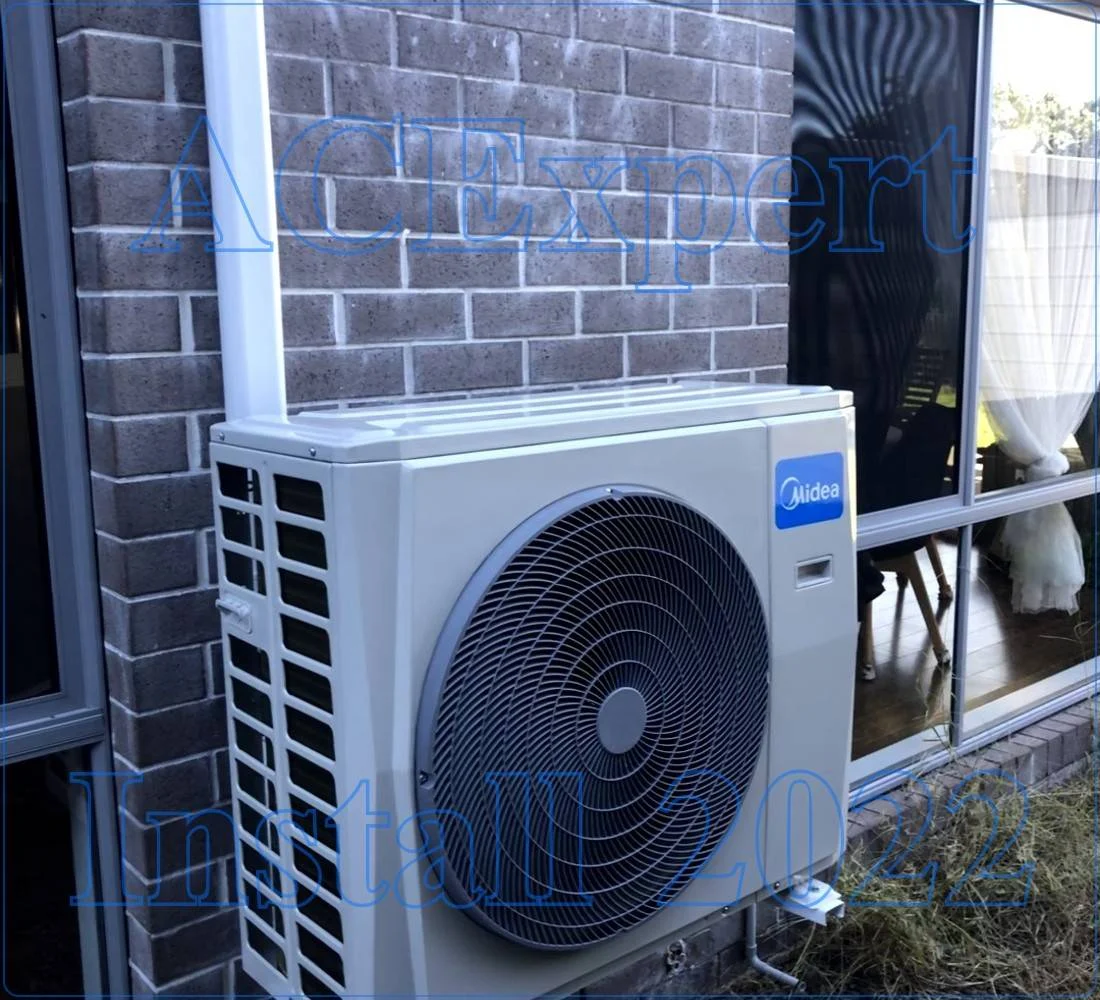 Split system unit mounted outside a Melbourne apartment building above a ground-floor cafe